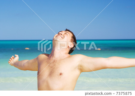 happy man on the beach 7375875