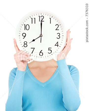 woman with big clock covering face woman with big clock covering face 7376310