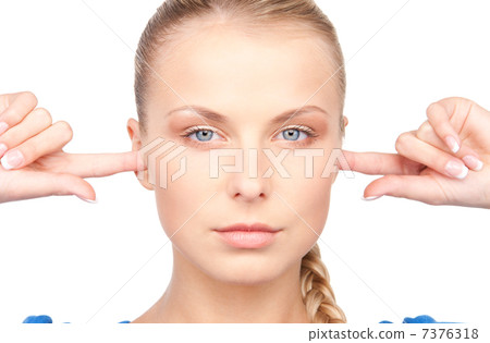 woman with fingers in ears 7376318