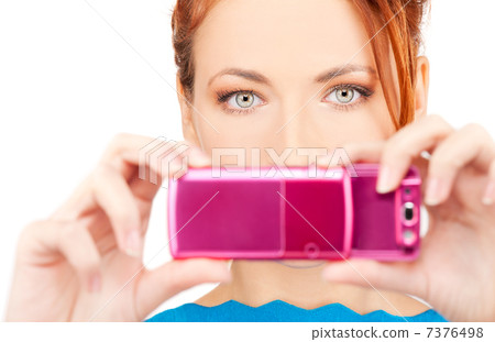 redhead woman using phone camera redhead woman using phone camera 7376498