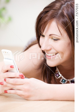 woman with white phone 7377033