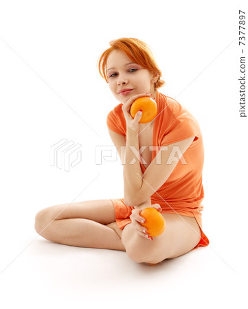 cheerful redhead with two oranges cheerful redhead with two oranges 7377897