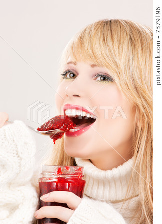 happy teenage girl with raspberry jam 7379196