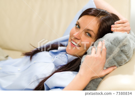 Happy woman resting lying on couch 7380834