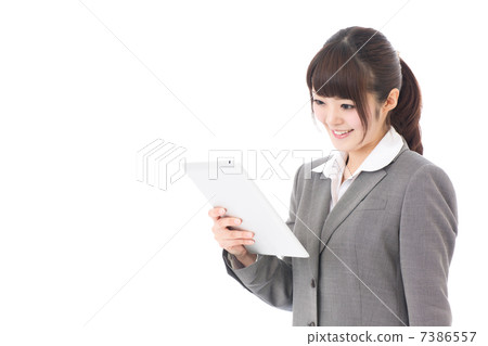 Business woman using a tablet image Business woman using a tablet image 7386557
