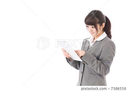 Business woman using a tablet image Business woman using a tablet image 7386558