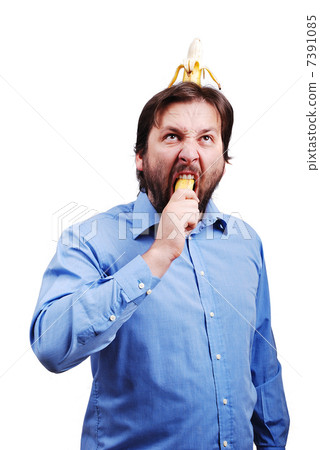 Young man blowing up his brain with banana Young man blowing up his brain with banana 7391085