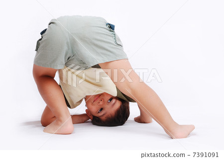 A little cute kid is playing isolated in white 7391091