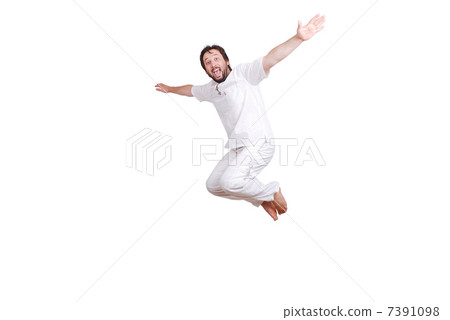 Happy young male in white clothes is jumping isolated Happy young male in white clothes is jumping isolated 7391098