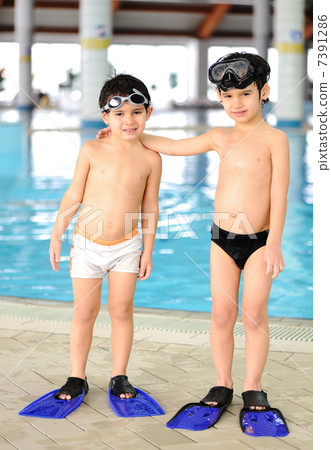 Activities at the pool, children swimming and playing in water, happiness and summertime Activities at the pool, children swimming and playing in water, happiness and summertime 7391286