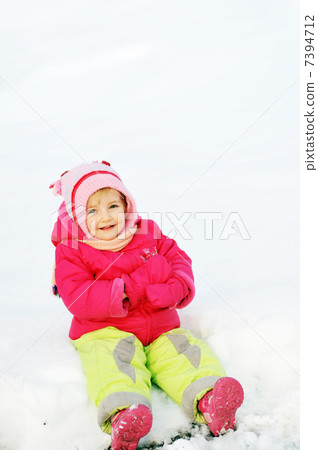 girl sits on snow 7394712