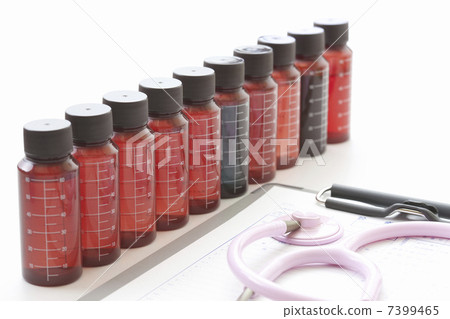 Bottle of medicine and stethoscope 7399465