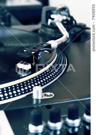 Turntable playing vinyl music record 7408950