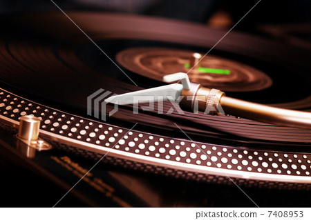 Turntable playing vinyl record 7408953