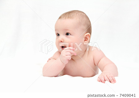 Beautiful happy baby lies on white blanket 7409041