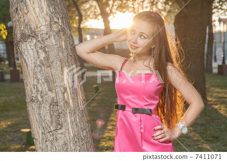 girl in backlit at sunset in park 7411071