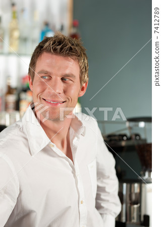 Coffeeshop - barista in his café 7412789