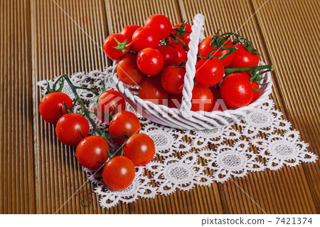 Fresh tomatoes on wooden background 7421374