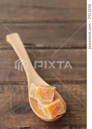 Sweet potato amanatto on a spoon - Japanese confectionery Sweet potato amanatto on a spoon - Japanese confectionery 7423856