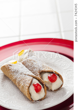 Two Tasty Cannoli on Plate 7424345