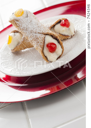 Two Tasty Cannoli on Plate 7424346
