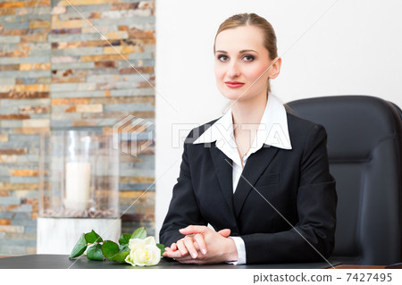 Mortician in her store 7427495