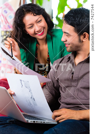 Fashion designer working at home 7427544