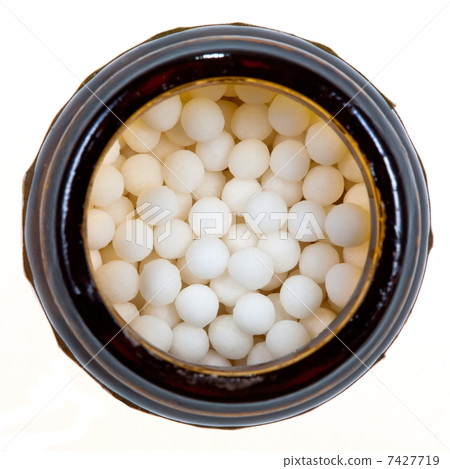 vial with homeopathy sugar ball 7427719