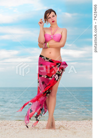 Woman in flowered pareo 7428466
