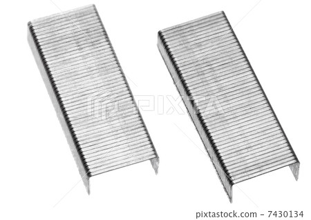 Stack of metal staples. Isolated on a white. 7430134