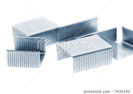 Stack of metal staples. Isolated on a white. 7430140