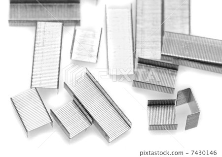 Stack of metal staples. Isolated on a white. 7430146