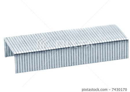 Stack of metal staples. Isolated on a white. 7430170
