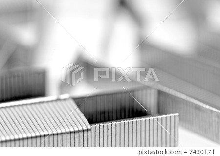 Stack of metal staples. Isolated on a white. 7430171