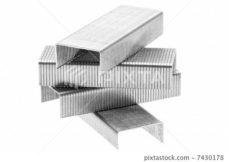 Stack of metal staples. Isolated on a white. 7430178