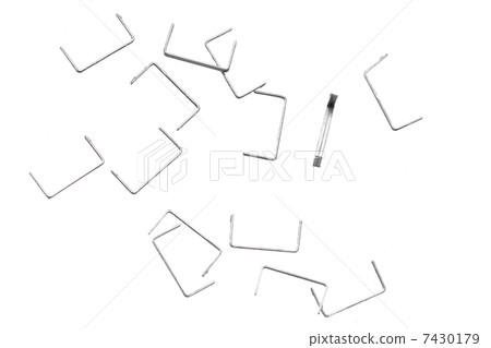 Stack of metal staples. Isolated on a white. 7430179