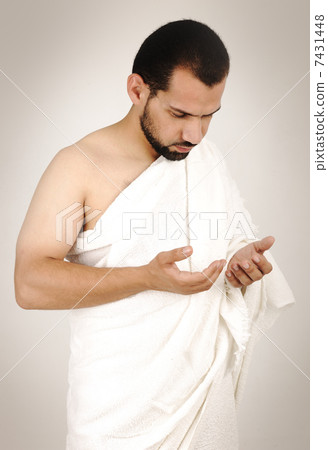 muslim pilgrims in white traditional clothes 7431448