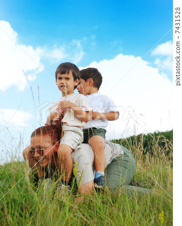 Two kids on back of their gradmother Two kids on back of their gradmother 7431528