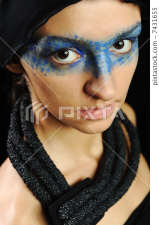 Very pretty woman with dark scarf and colorful mask eyes, fashion stylish model Very pretty woman with dark scarf and colorful mask eyes, fashion stylish model 7431655