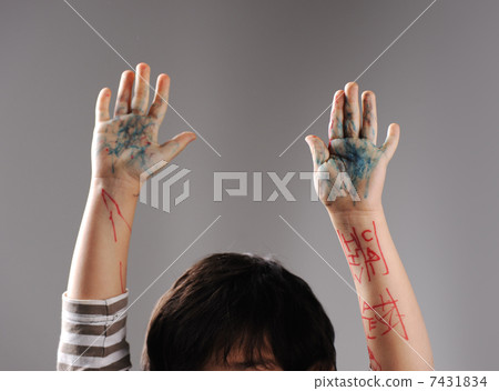 Messy hands, little guilty surrender with hands up 7431834