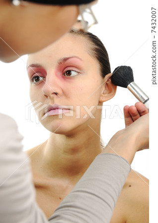 Putting on make up with brush 7432007