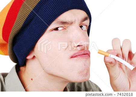 Funny face young man with cigarete in hand 7432018