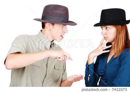 Two young adults are arguing with each other 7432073