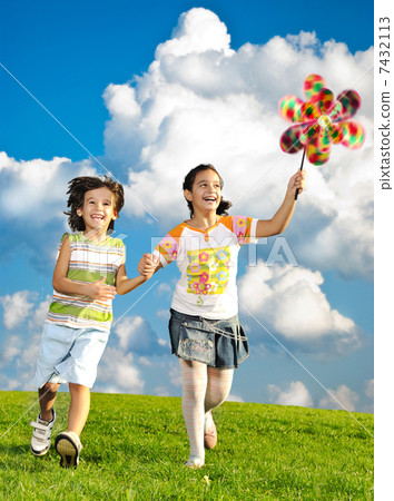 Fantastic scene of happy children running and playing carefreely 7432113