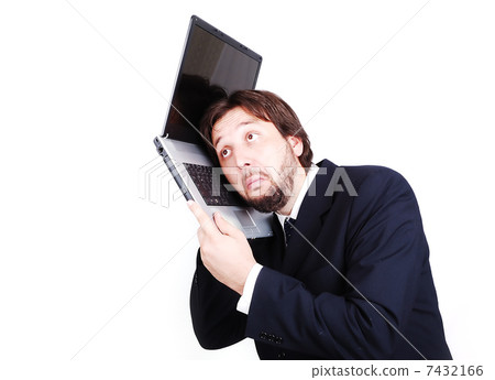 Young male model in modern suit with laptop 7432166