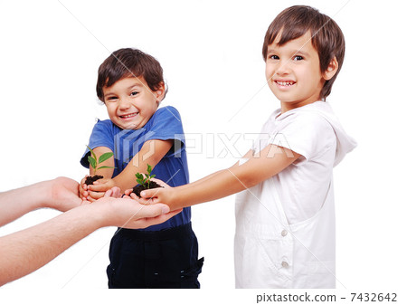 Little cute children holding green plant in hands 7432642