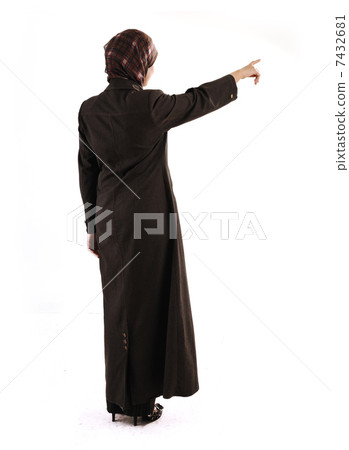 Muslim girl pointing on white background 7432681
