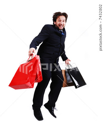 Young attractive bussinesman with shopping bags jumping 7432802