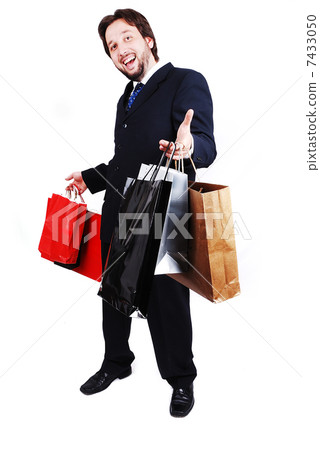 Young attractive man wearing suit and holding shopping bags Young attractive man wearing suit and holding shopping bags 7433050