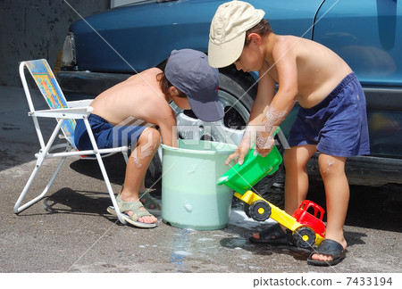 Child washing car and toy car Child washing car and toy car 7433194